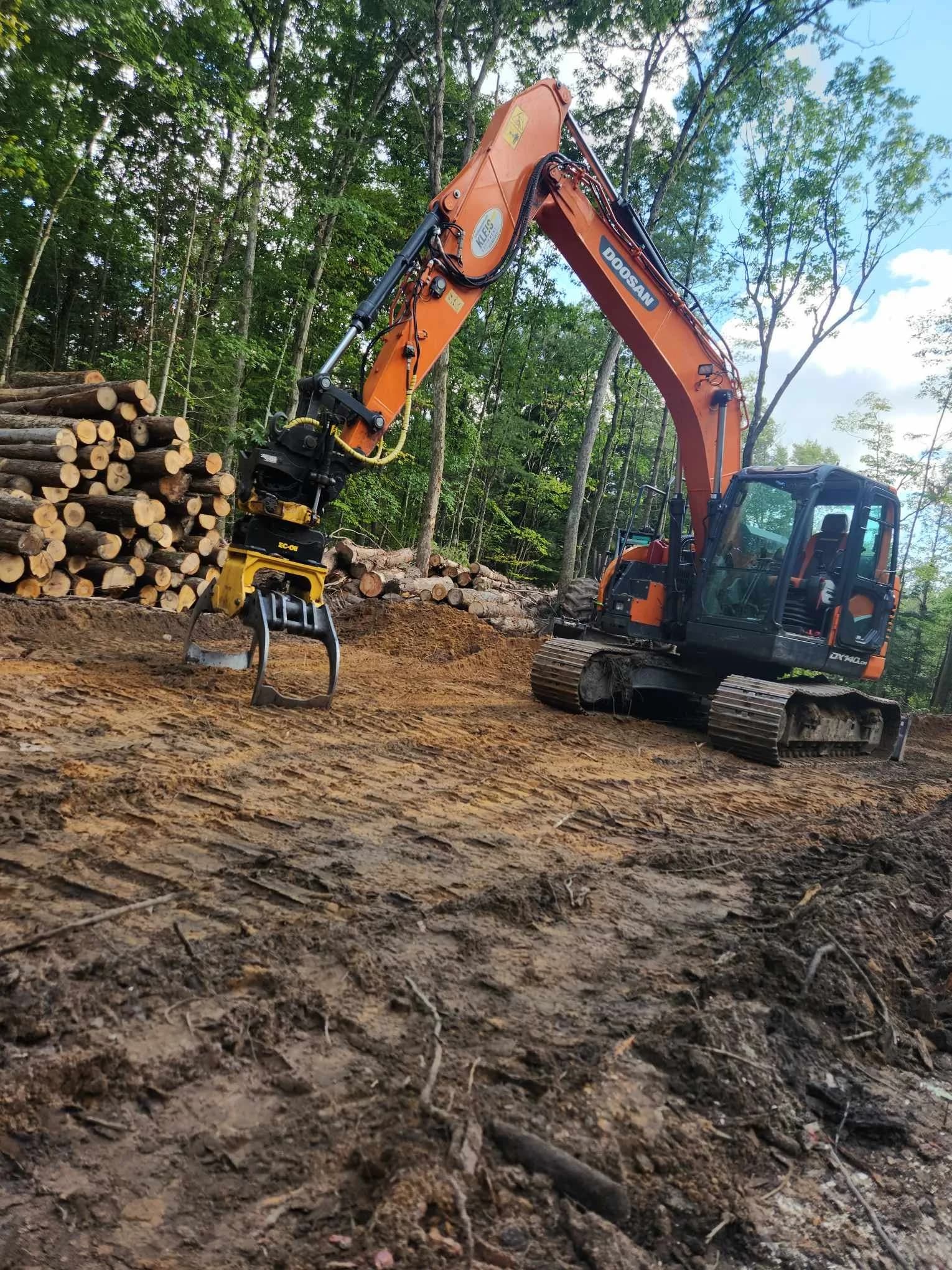 Forwarder moving cut logs