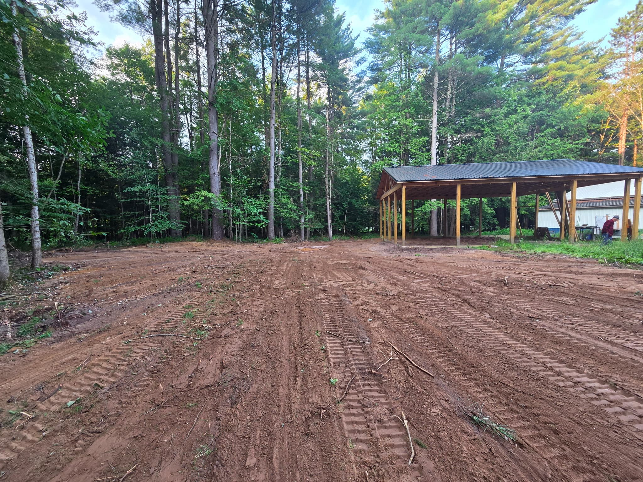 Completed clearing and grading around an existing shelter